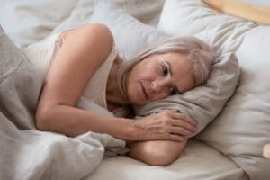 Woman awake in bed