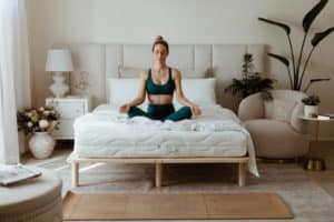 Person sitting on a bed